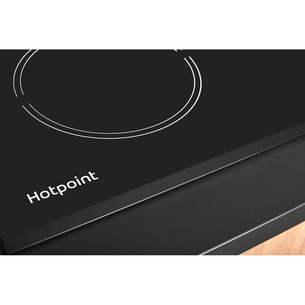 Hotpoint HR724CH 77cm black double ring zone electric ceramic hob with touch control, showing sleek black surface and control panel.