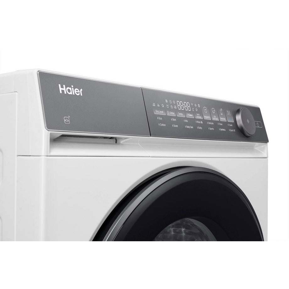 Haier HD100-C367U1-UK 10kg white heat pump tumble dryer with digital display and control panel.